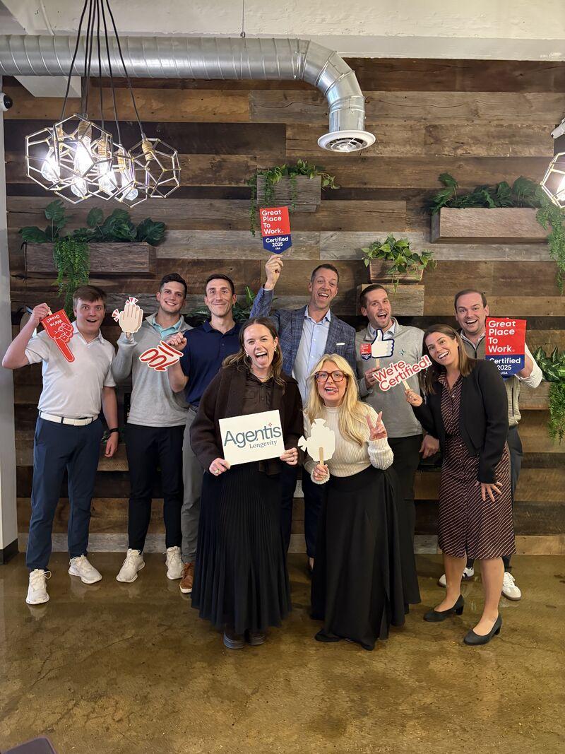 Agentis team collaborating around a table